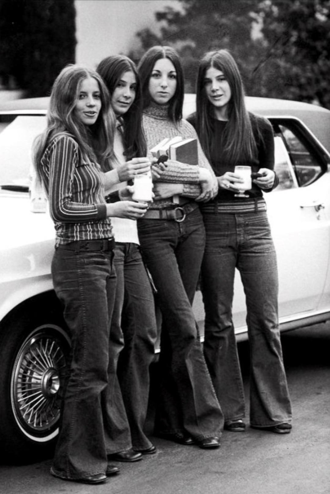 Girls in the parking lot at school. 1970. 
